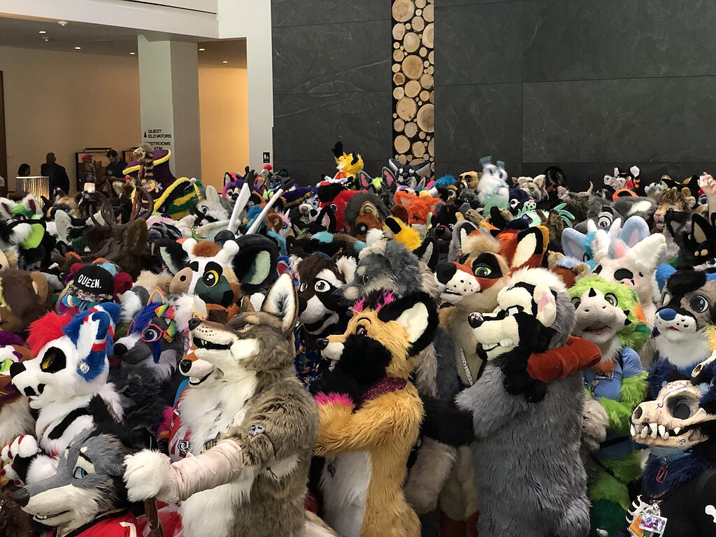 A large crowd of furries at a furry convention. 