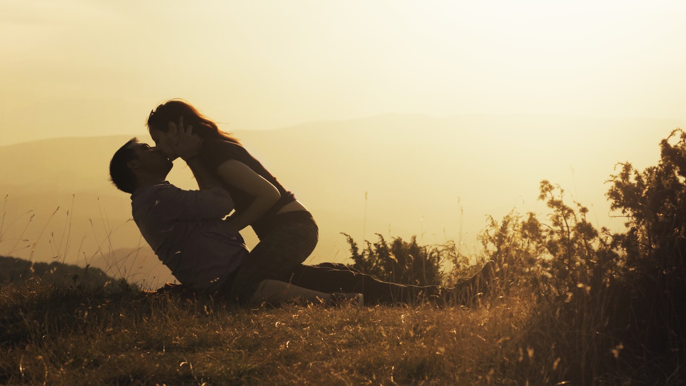 lusty young couple making out in nature